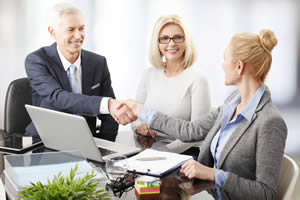 Three people discussing business; trusts can be of use