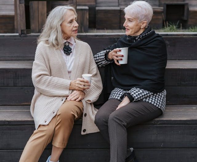 estate plan, living trust, image of two senior women chatting outdoors