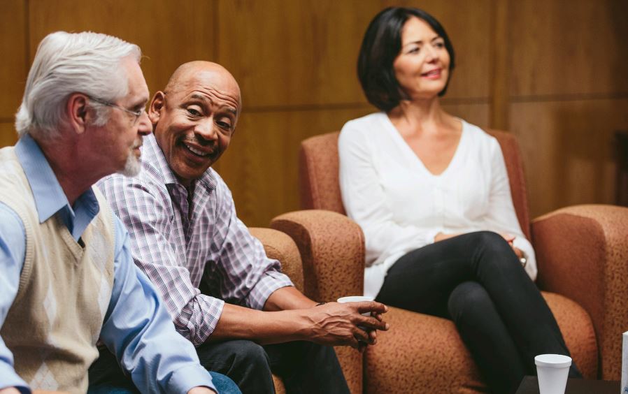 Two-Senior-Persons-Talking-About-Alzheimers-Association-Caregiver-Support-Group